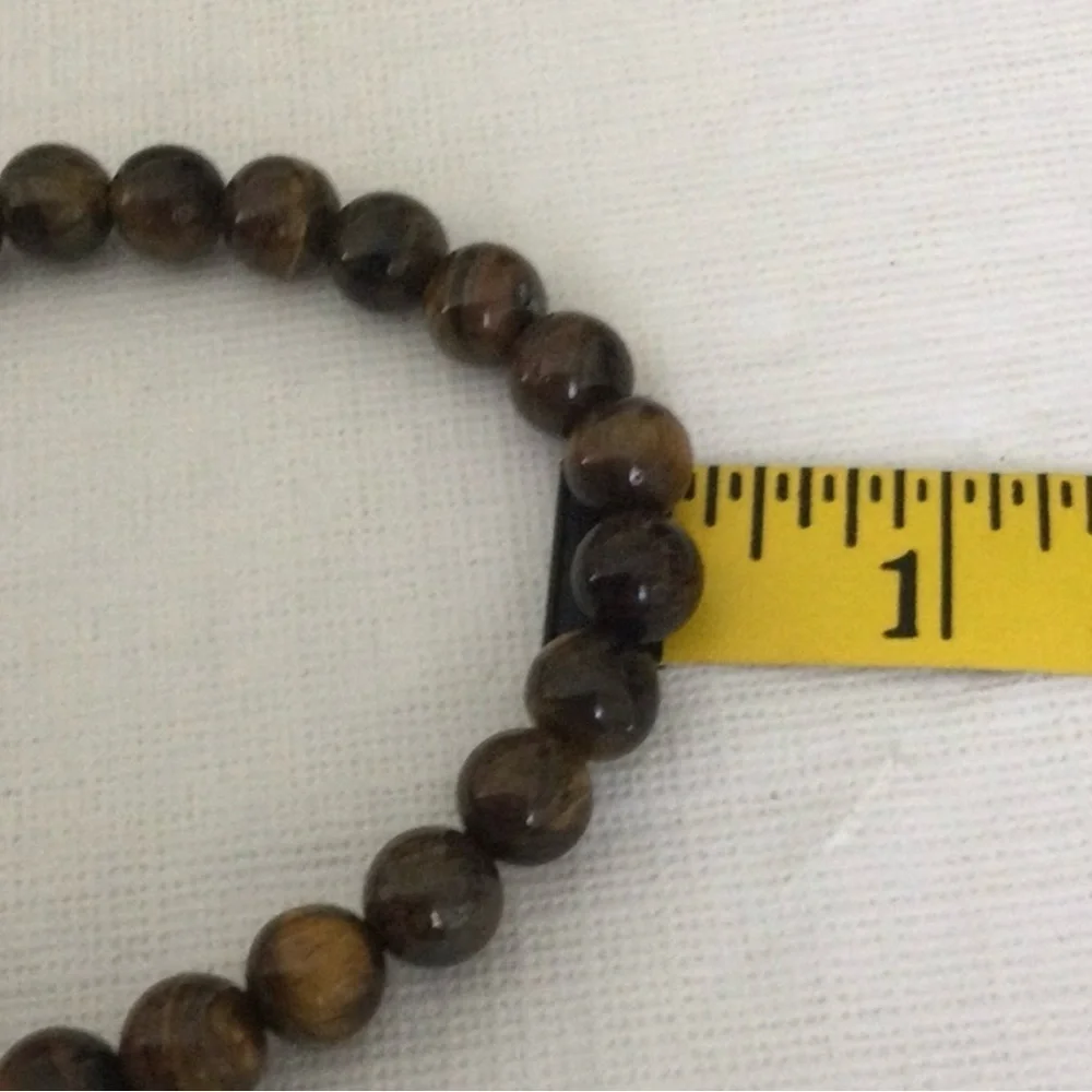 Woman’s Cats Eye Polished Beaded color brown stretch elastic